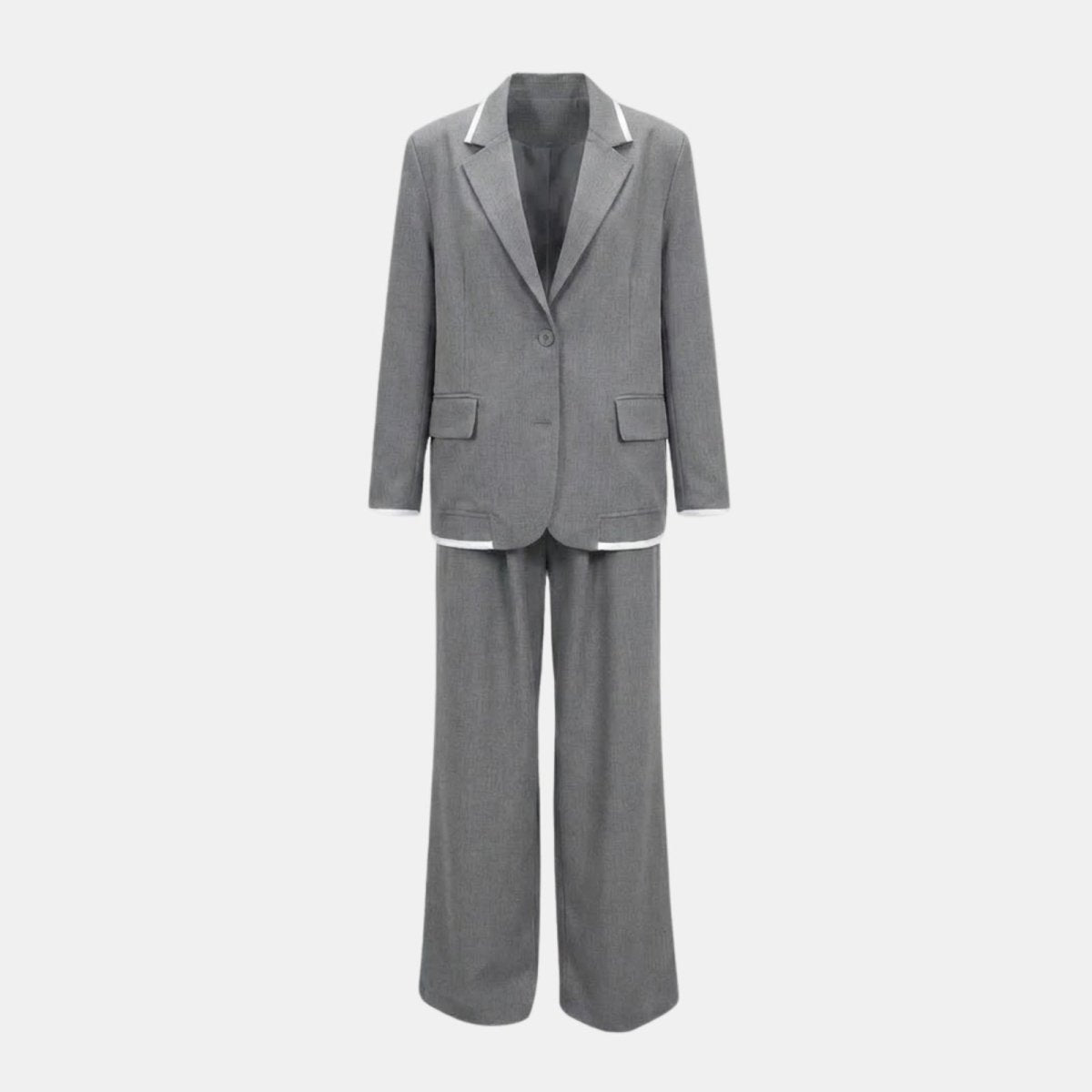 Flatlay of the Kouvr Lucia Set grey pantsuit showing the front of the single-breasted blazer with white piping and the matching wide-leg pants.