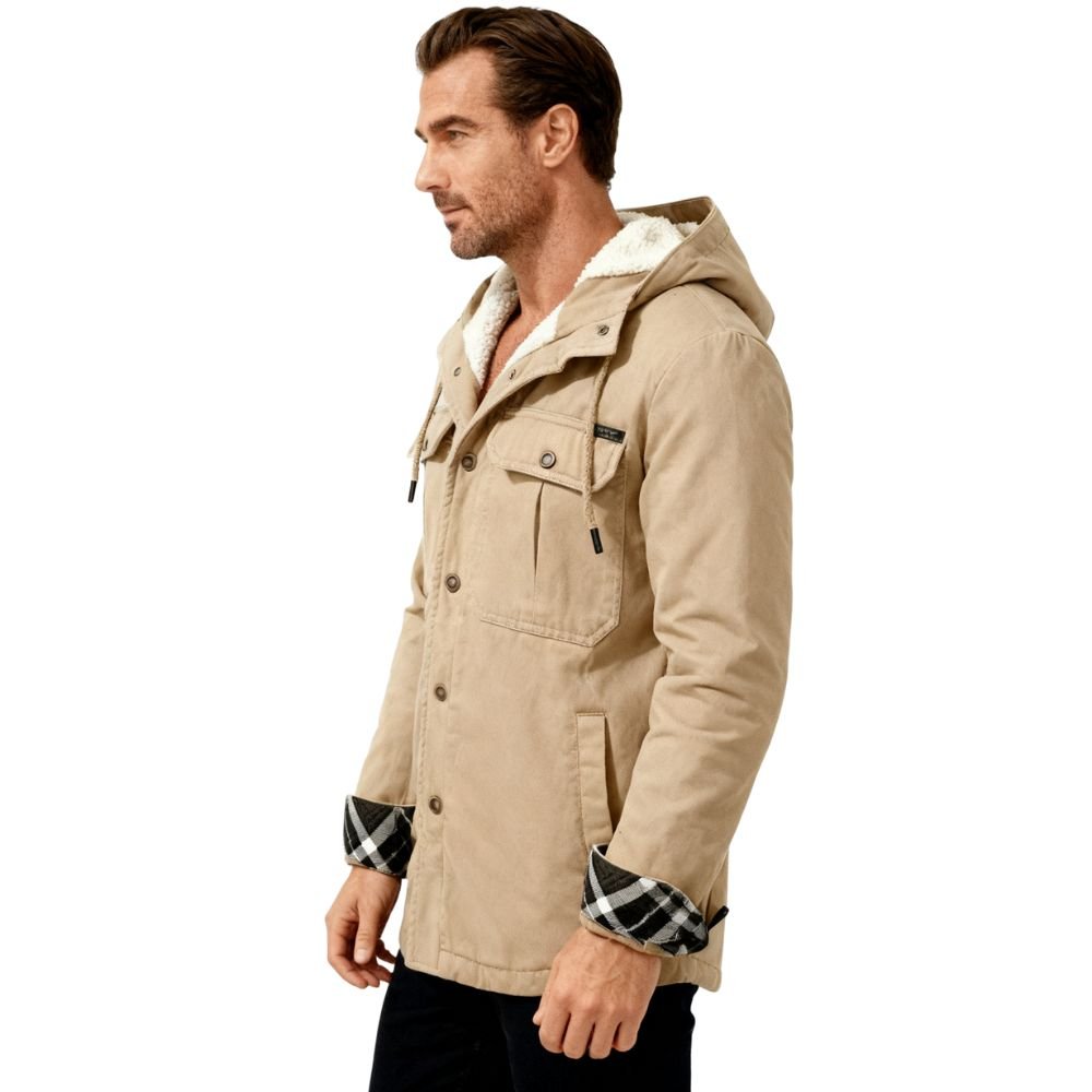 Man wearing a khaki kouvr jacket with a hood on a white background