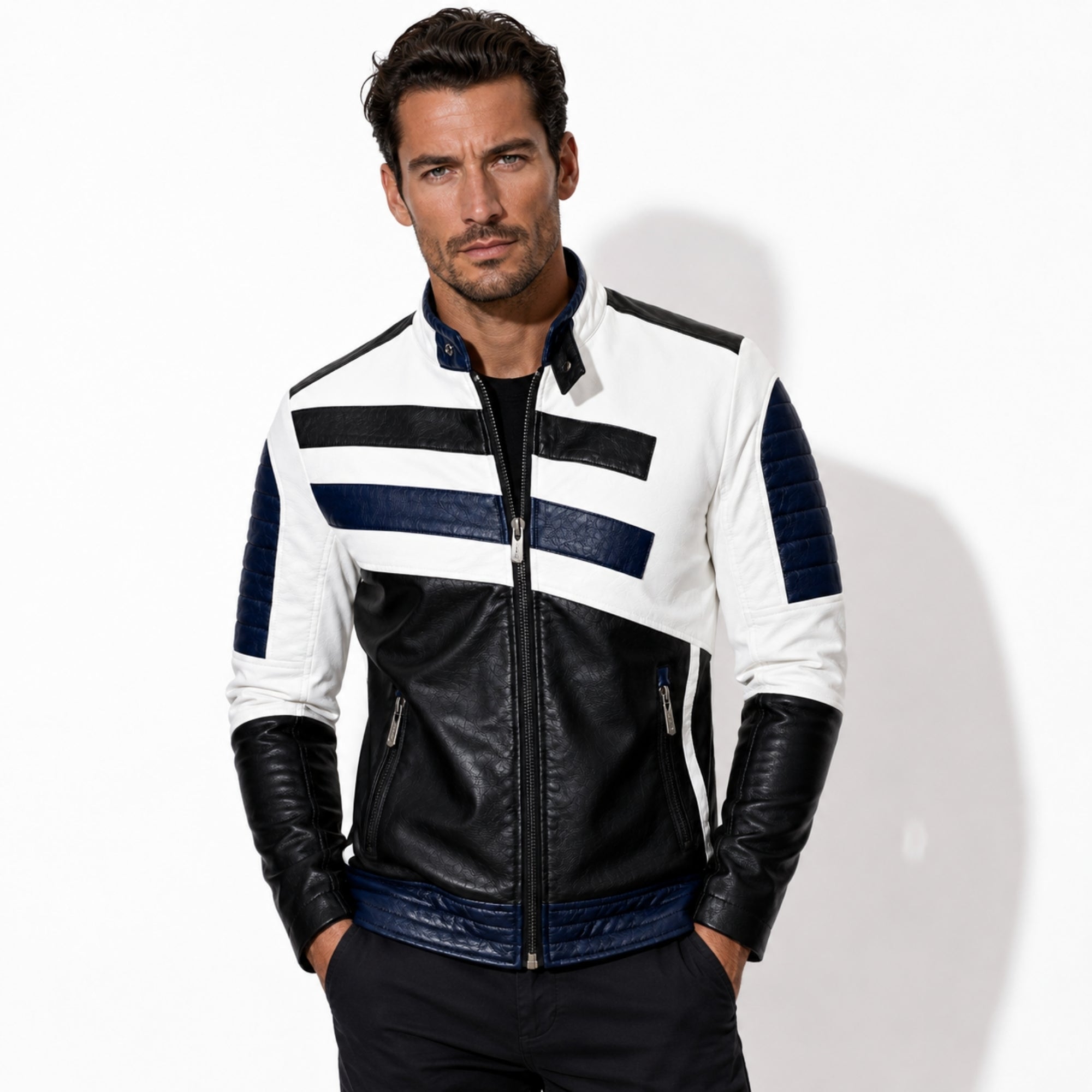 Front view of a male model wearing the Kouvr men's premium white and black leather moto jacket featuring navy blue racing stripes and quilted shoulders.