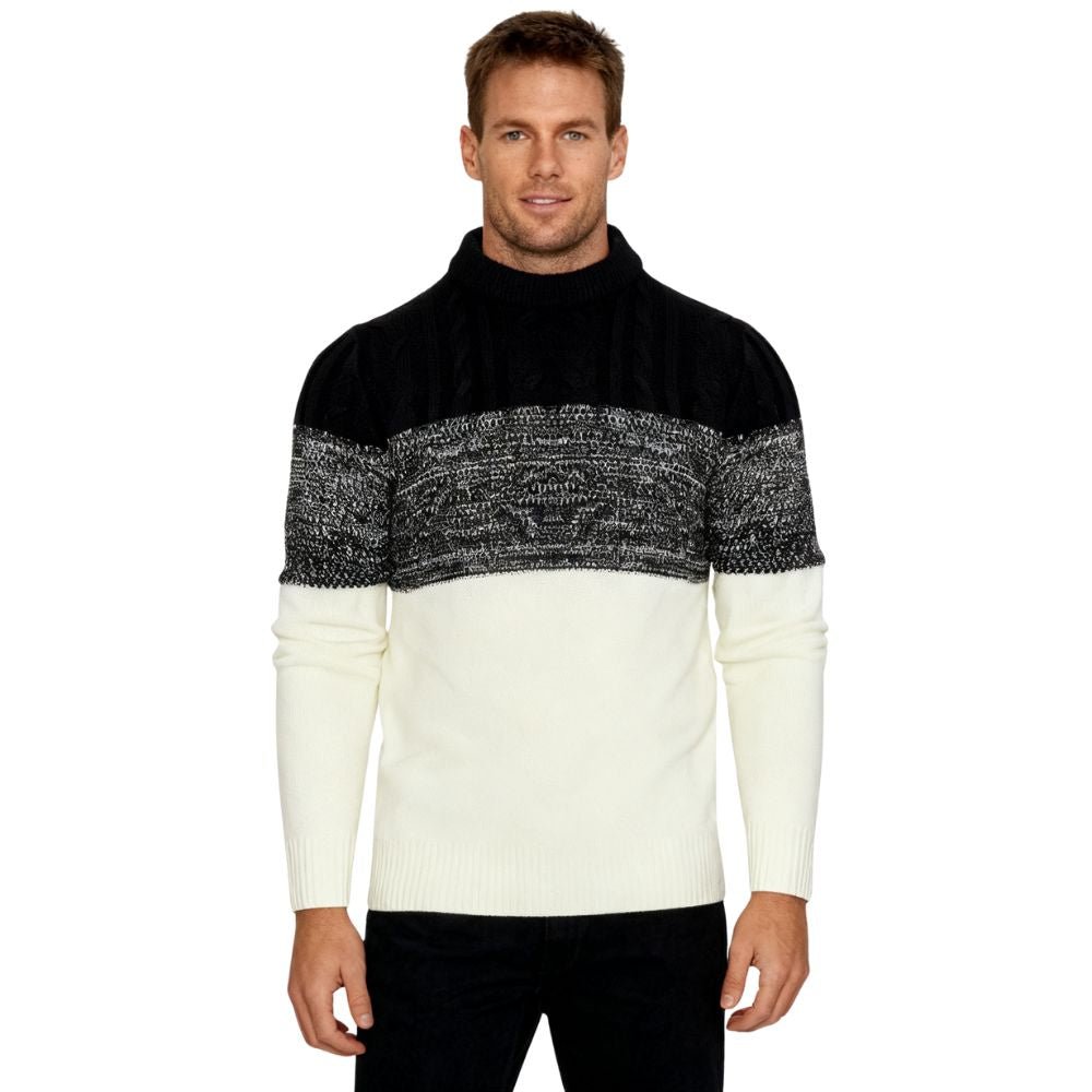 Man wearing a black and white kouvr sweater on a white background