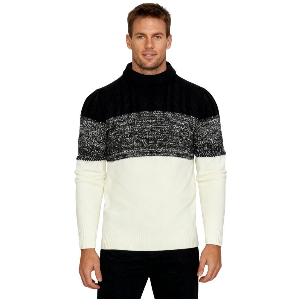 Man wearing a black and white kouvr sweater on a white background