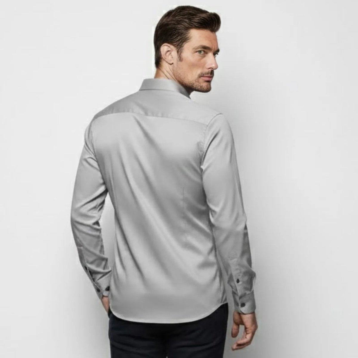 Back view of the Kouvr men's slim fit button-down shirt in light grey, showing the back yoke and tailored fit.