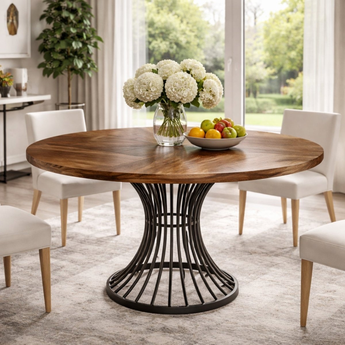 Kouvr Meridian 47 inch round dining table with walnut chevron patterned top and black metal cage base in a modern luxury dining room.