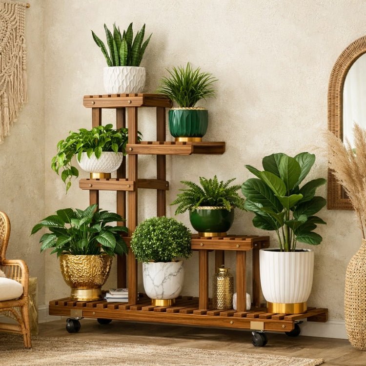 A large multi-tier wooden plant stand styled with seven modern white, green, and gold pots in a bright, bohemian-style living room with a rattan chair.