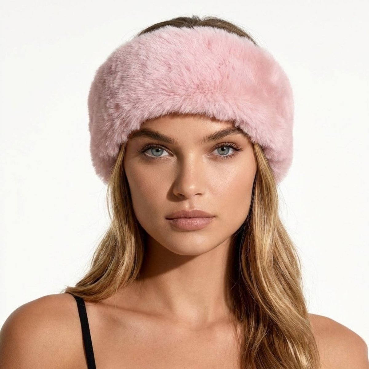 Model looking forward wearing the Kouvr Nancie luxe pink faux fur headband.