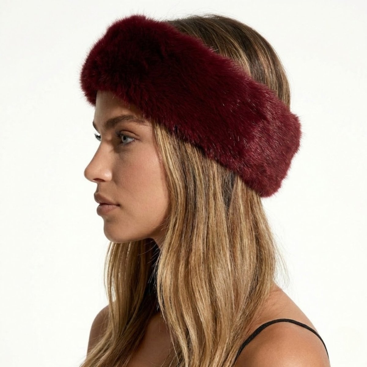 Side profile of a model wearing the Kouvr Nancie plush red faux fur winter headband.