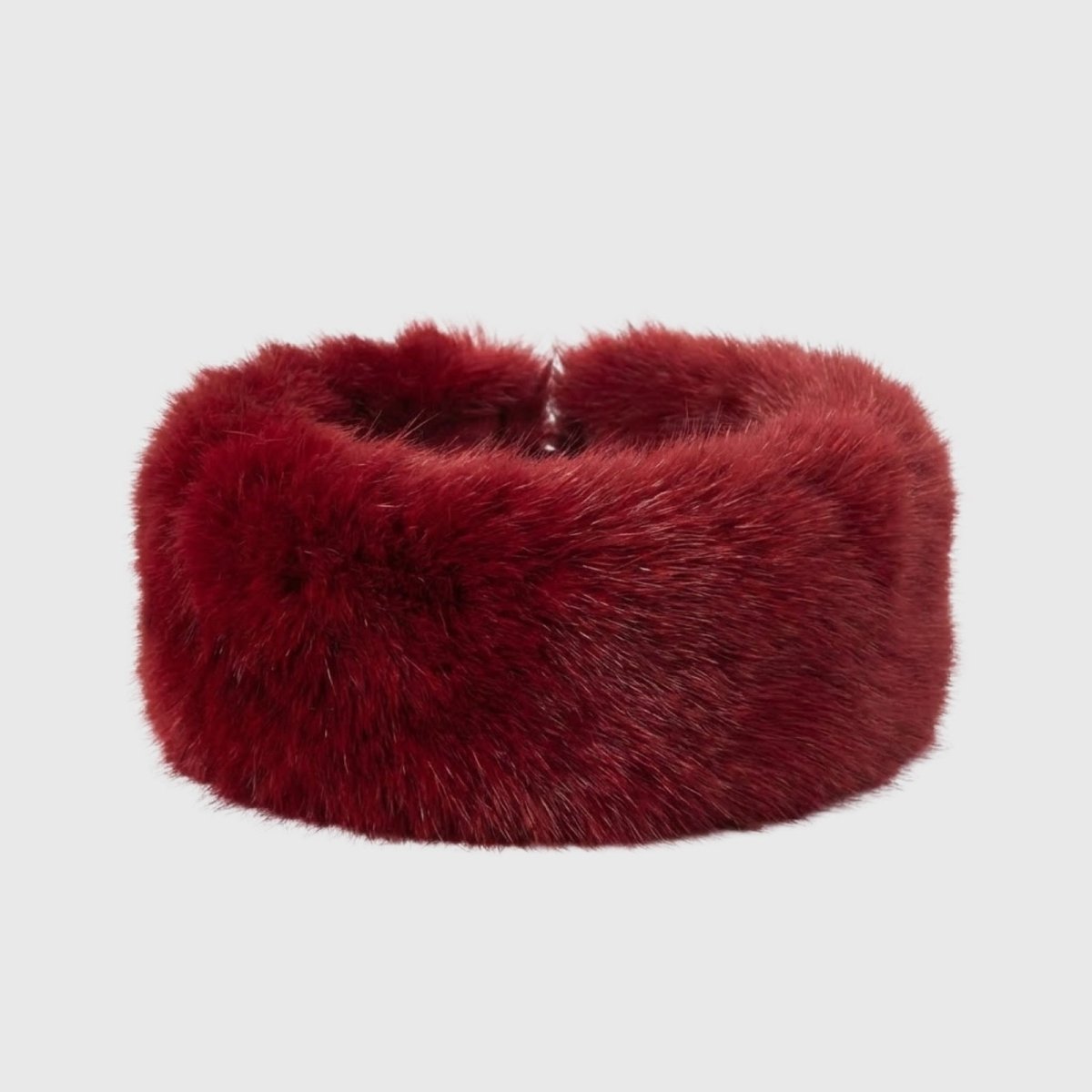 Product-only shot of the Kouvr Nancie soft red faux fur headband on a white background.