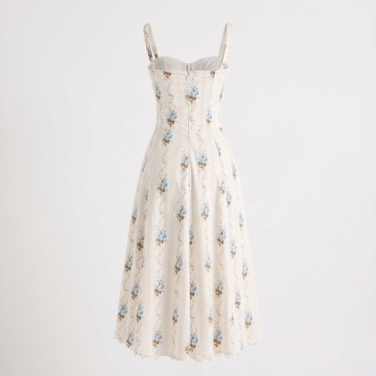 Back view flat lay of the Kouvr Nefeli cream dress, showing the zipper closure and corset seam details.