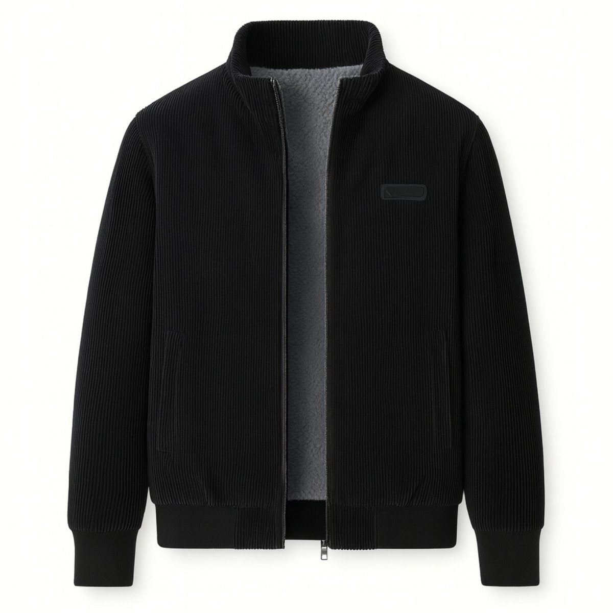 Flat lay of the open Kouvr Nick black corduroy jacket, displaying the full grey shearling fleece lining and texture.