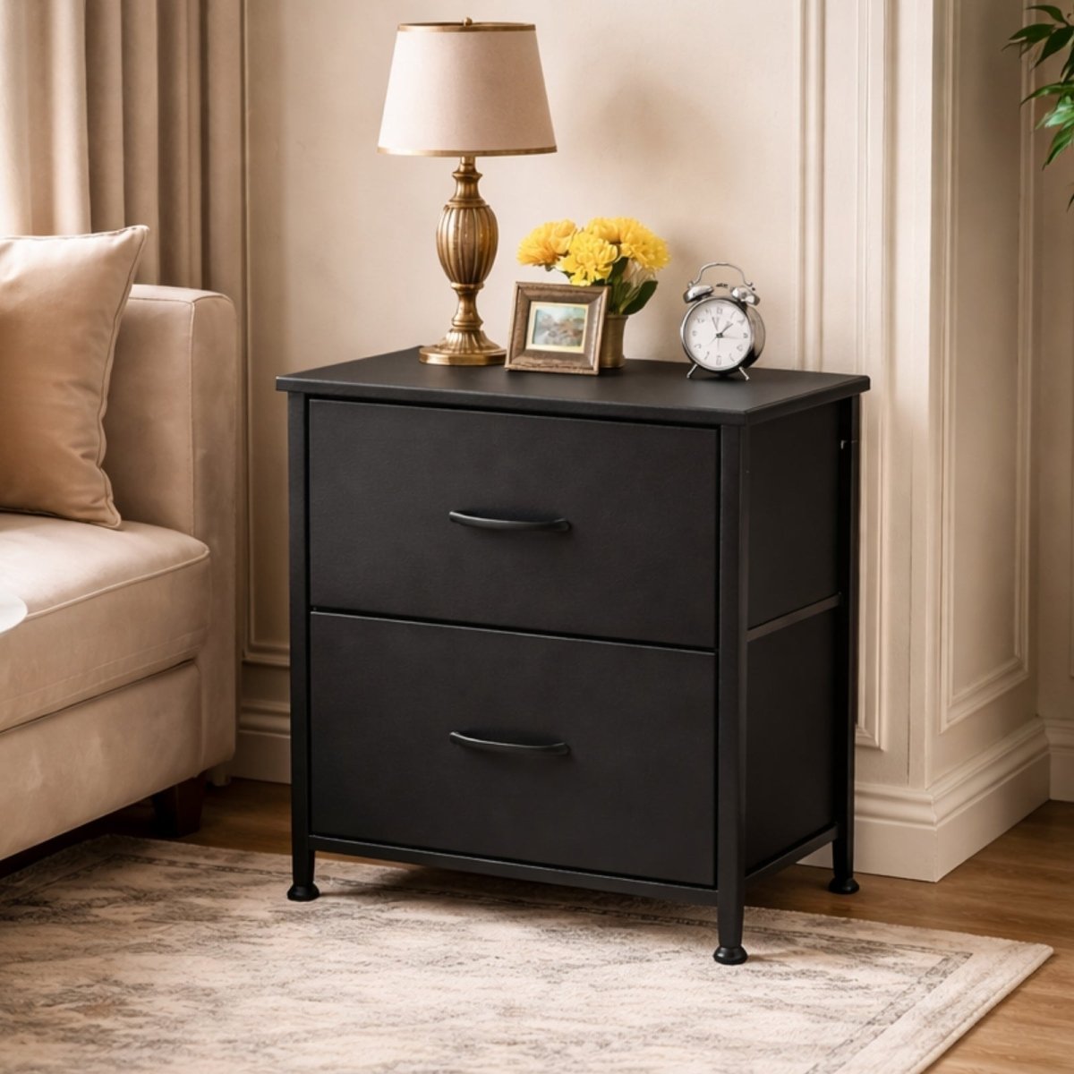 Detail shot of the Kouvr nightstand showing the durable black steel frame construction and an adjustable leveling foot for stability.