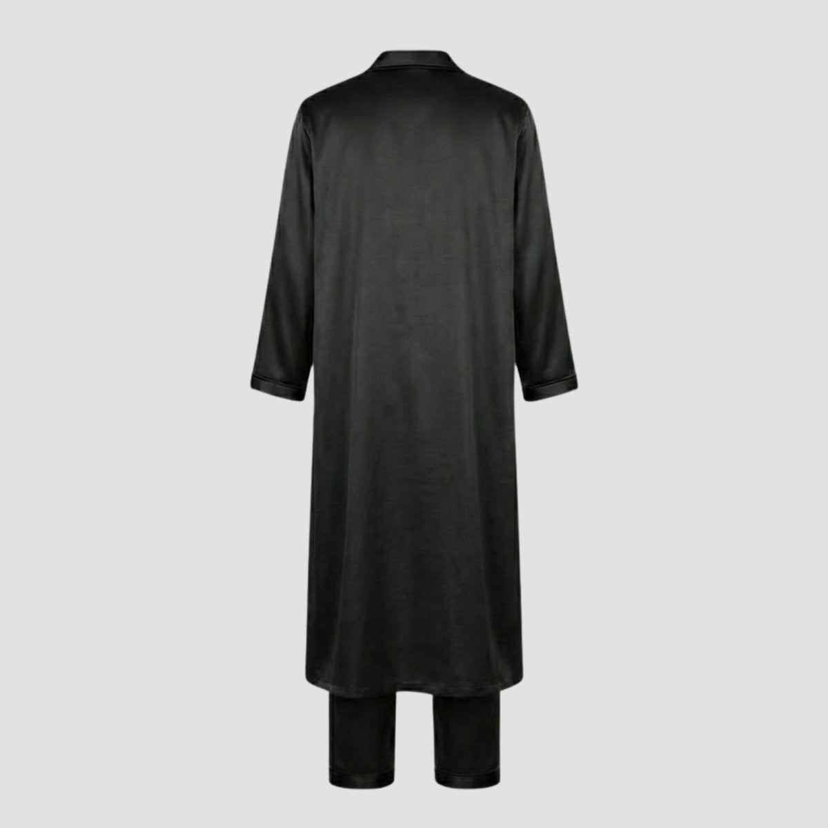 Back view flatlay of the Kouvr black silk pajama set and robe, showing the construction and finish of the garments.
