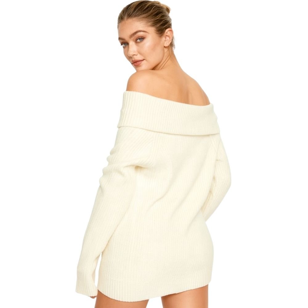 Woman wearing a kouvr  cream off-shoulder sweater dress on a white background