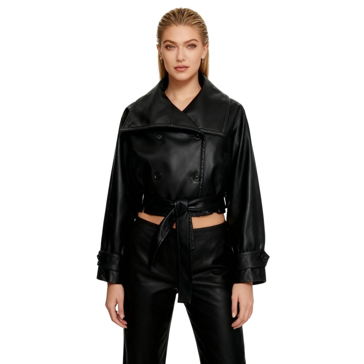 Model wearing Kouvr's black cropped faux leather trench jacket with belted waist
