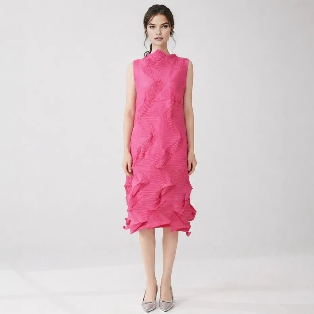 Woman wearing Kouvr pink 3D pleated sleeveless midi dress with high neck looking forward.