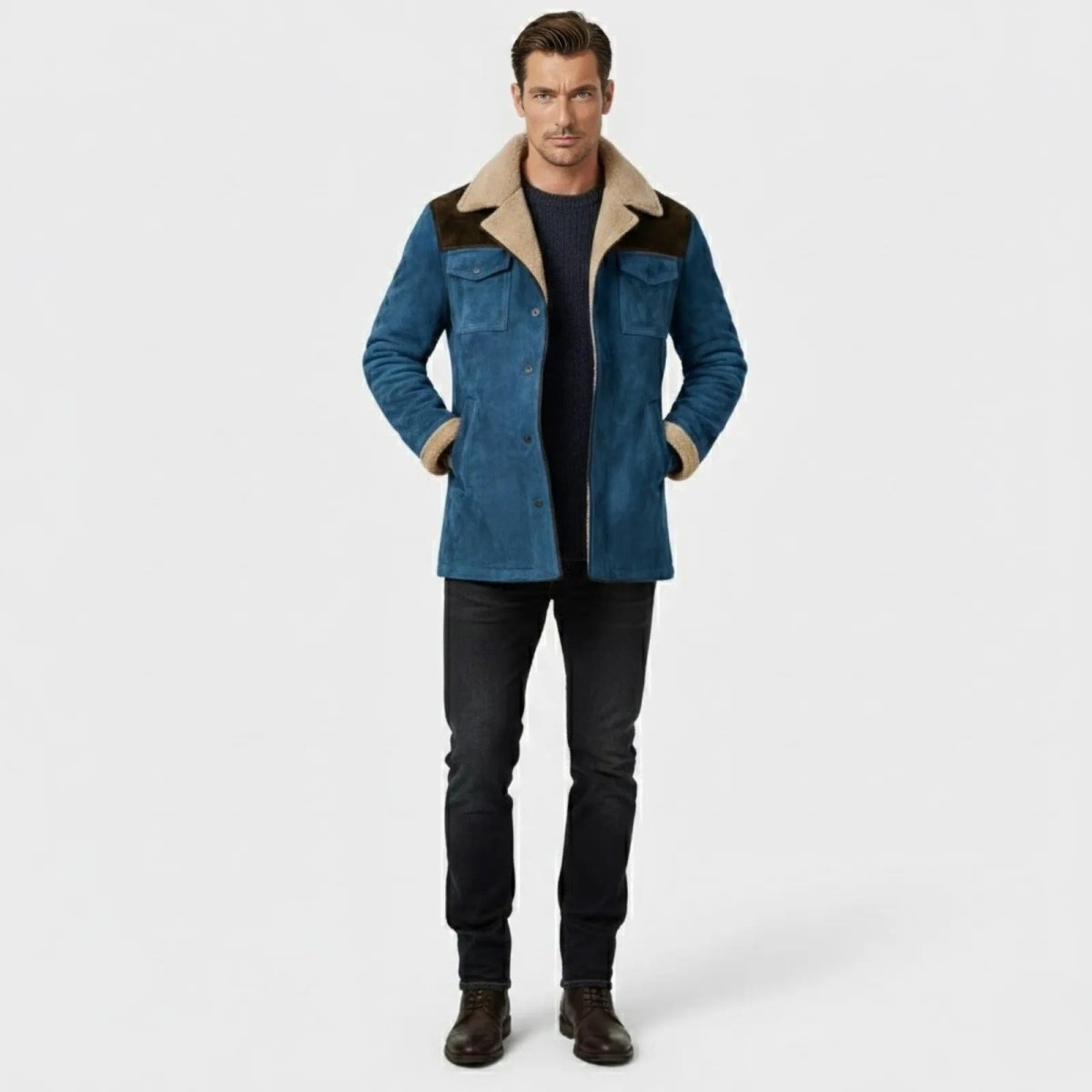 Man wearing the Kouvr Porter blue suede shearling jacket with dark jeans and boots, front view.
