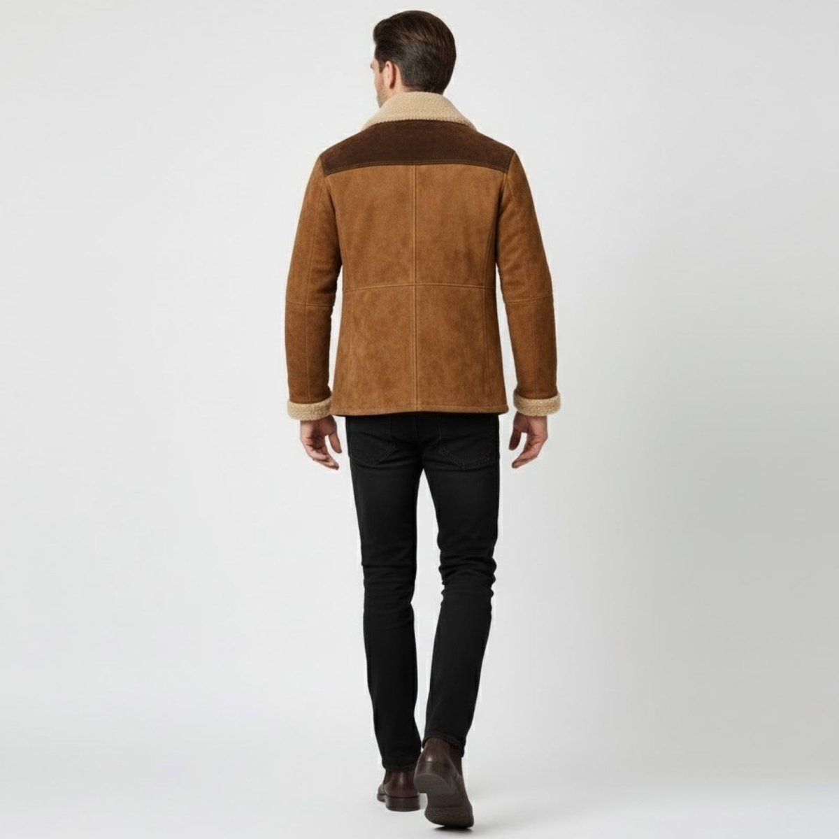 Back view of a man wearing the Kouvr Porter brown suede jacket highlighting the dark contrasting shoulder yoke.