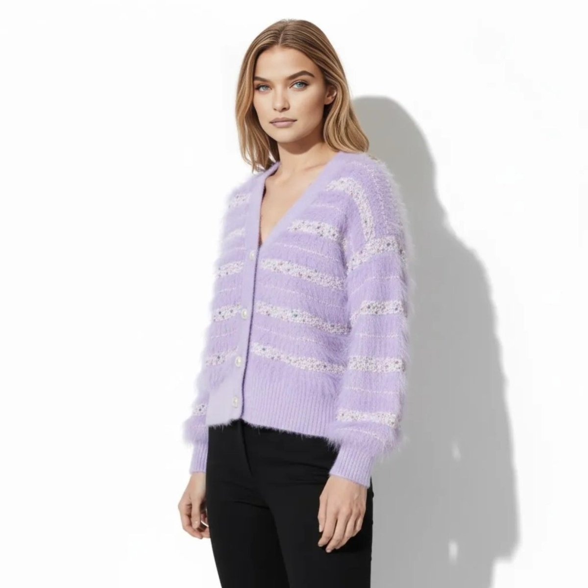 Side angle view of a model in the Kouvr soft purple textured cardigan, showcasing the bishop sleeve detail.