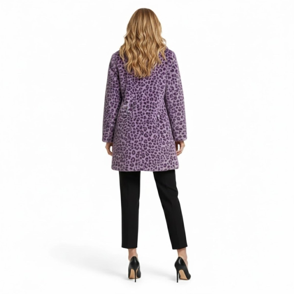 Back view of a model wearing the Kouvr purple leopard print faux fur coat, showcasing the animal print pattern and silhouette.