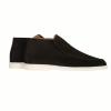 Product shot of the Kouvr Ralph men's black suede slip-on chukka boot with a durable white rubber sole on a clean white background.