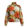 Product-only image of the Kouvr Regina floral sweater, showing the texture of the intarsia knit and vibrant orange, white, and green colors.