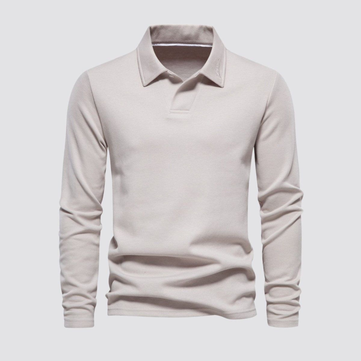 Front product shot of the Kouvr men's long sleeve knit polo in cream on a light grey background.
