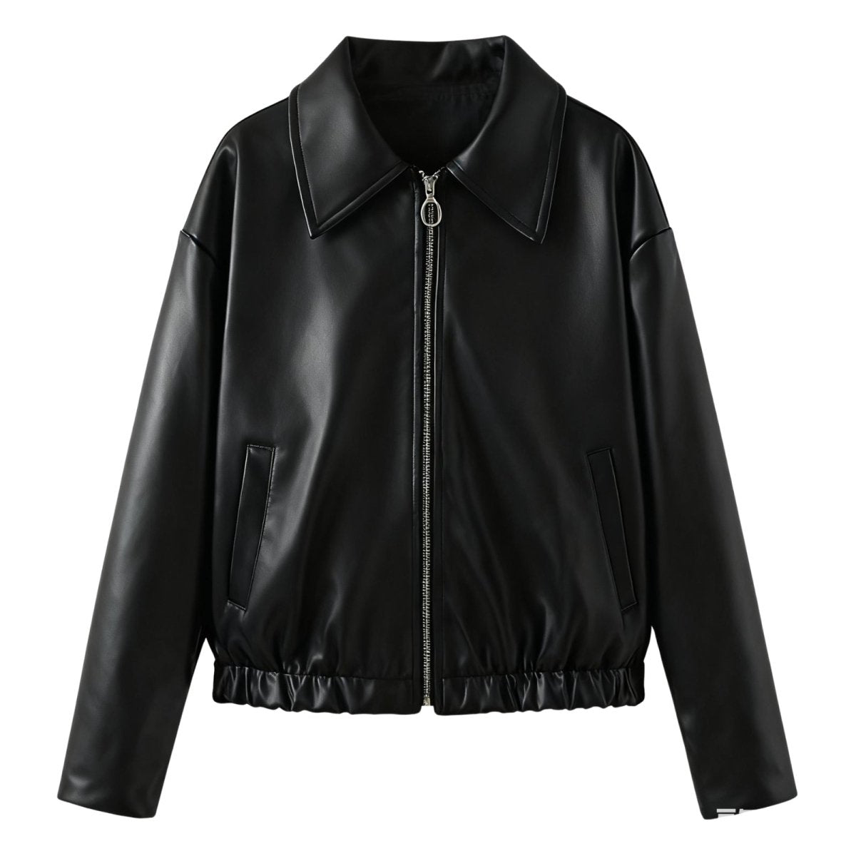 Model styling the Kouvr Rosalind oversized cropped black leather-look jacket with a black t-shirt and jeans.