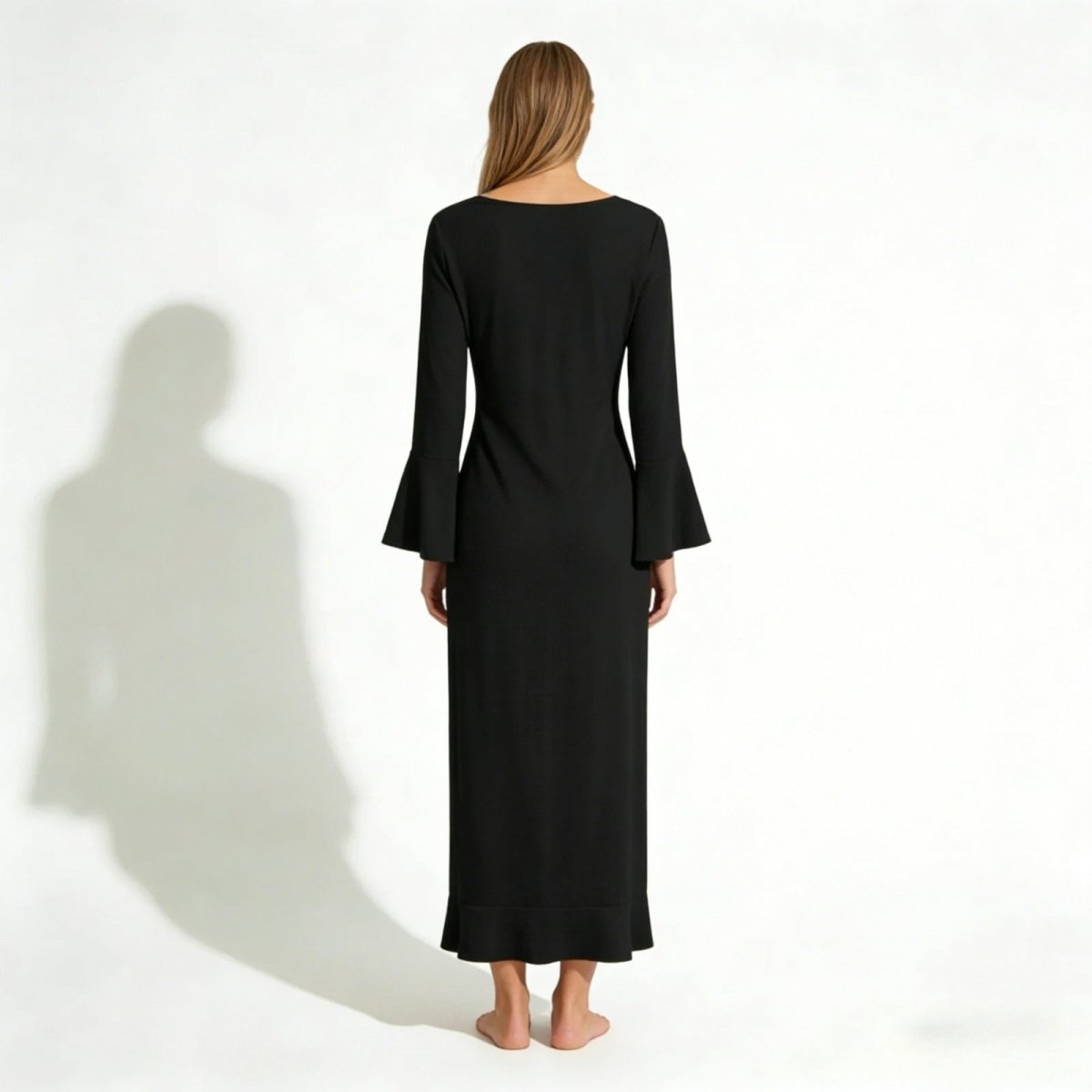 Back view of the Kouvr Fashion Roseta black maxi robe, showing the clean neckline and long bell sleeves.