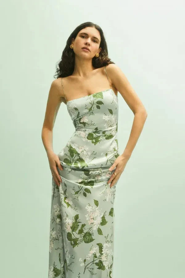 Model wearing the Kouvr Fashion Sage Green Silk Maxi Dress at an outdoor event
