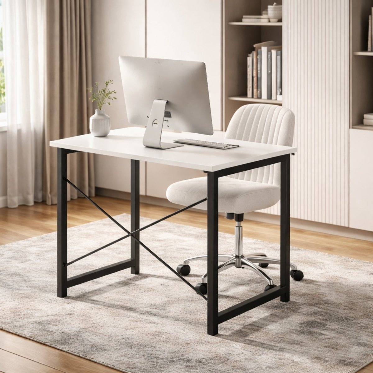 A minimalist white Kouvr Sanctum desk in a bright, modern home office featuring a single monitor and a white upholstered office chair.