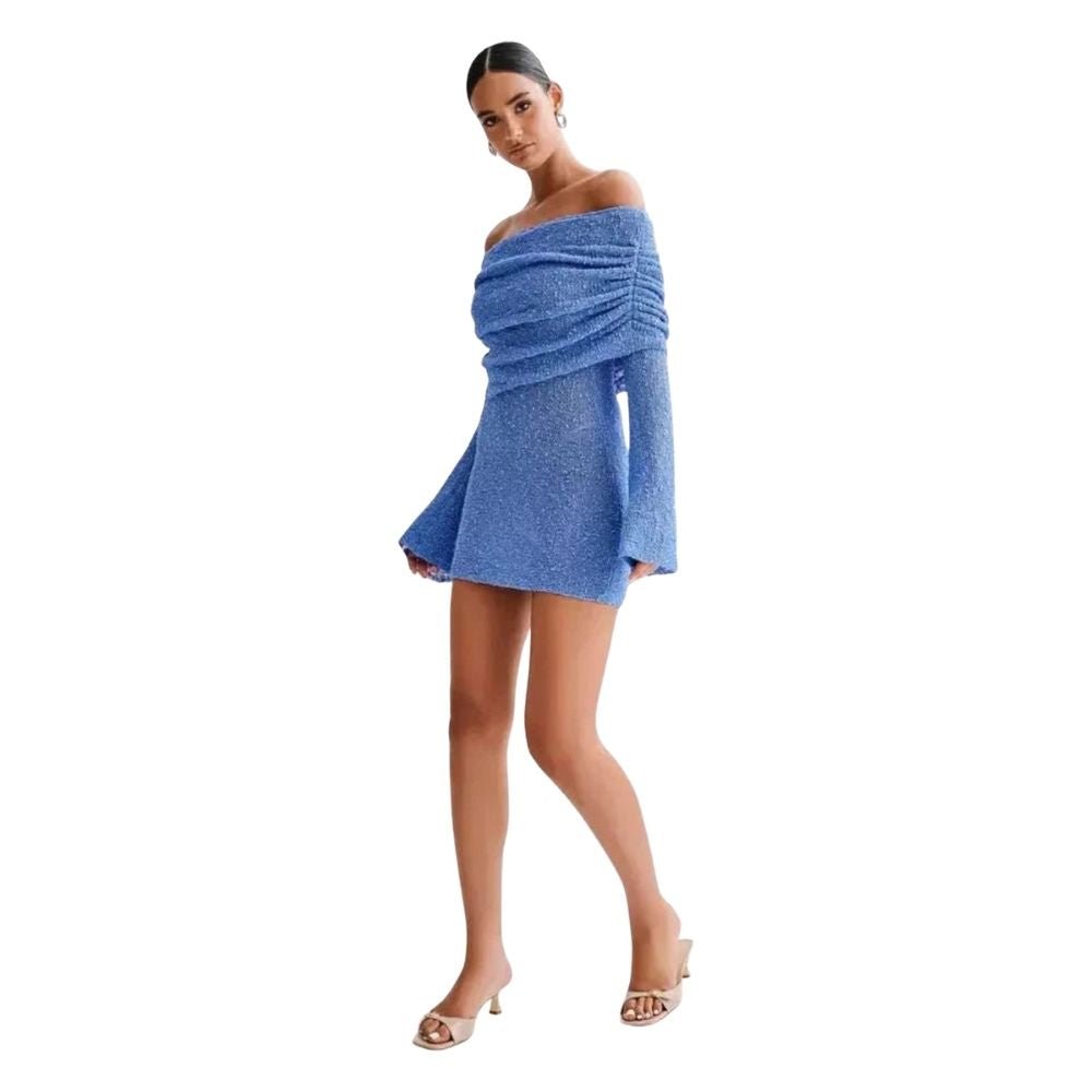 Woman wearing a blue kouvr off-shoulder dress on a white background