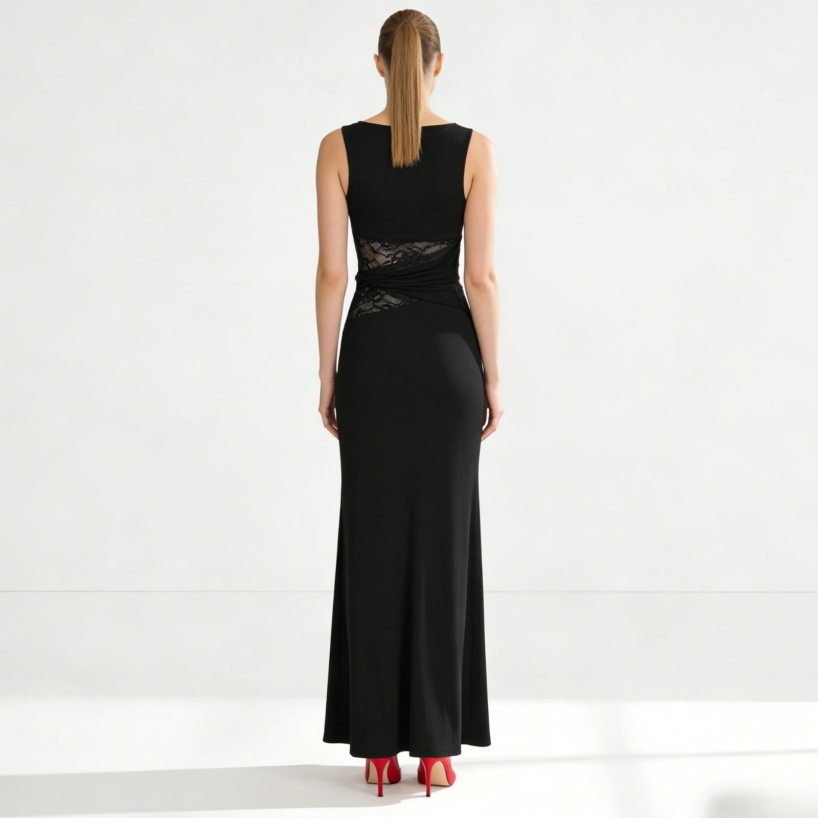 Back view of the Kouvr sleeveless black formal dress, showing the clean lines, high back, and concealed zipper detail.