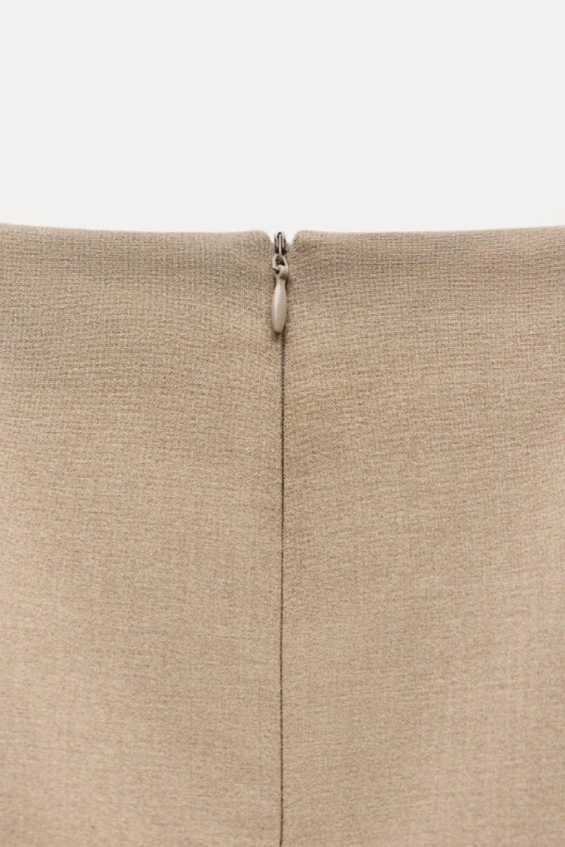 minimalist," "architectural," "modern," "fit and flare," "flounce hem," "day-to-night," and "structured fit