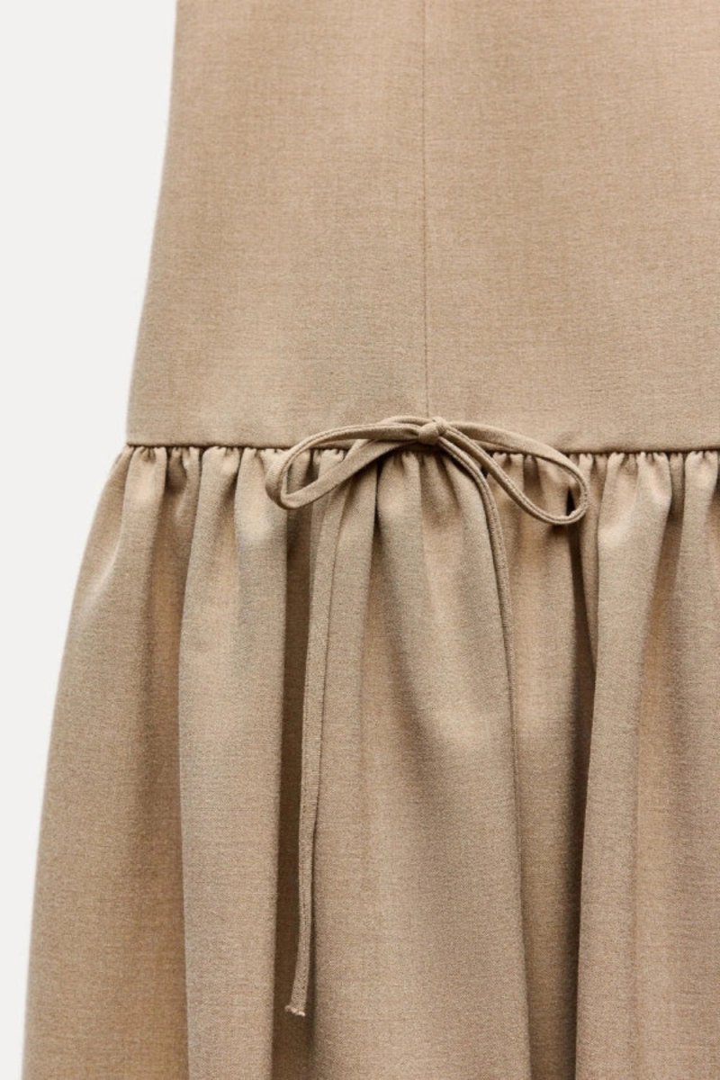 minimalist," "architectural," "modern," "fit and flare," "flounce hem," "day-to-night," and "structured fit