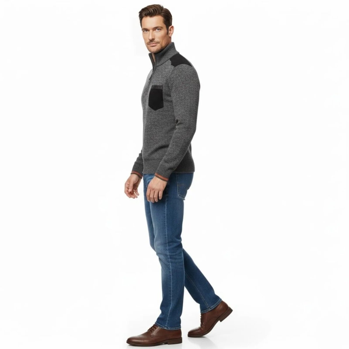 Side profile view of a man walking in the Kouvr Soren dark grey sweater, highlighting the modern fit and shoulder patch detail.