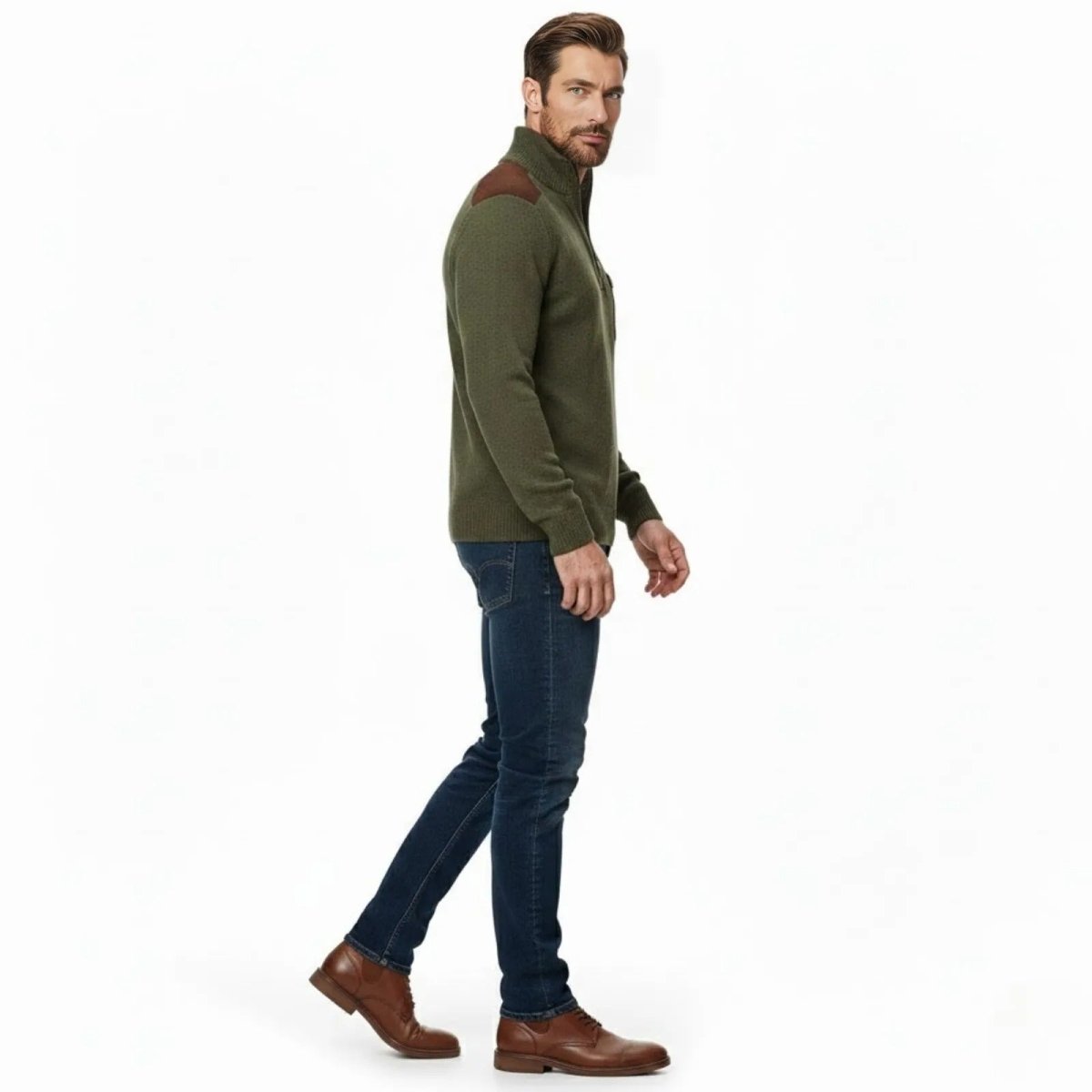 Side profile of a male model walking in the Kouvr Soren quarter-zip sweater, showing the tailored fit and sleeve length.