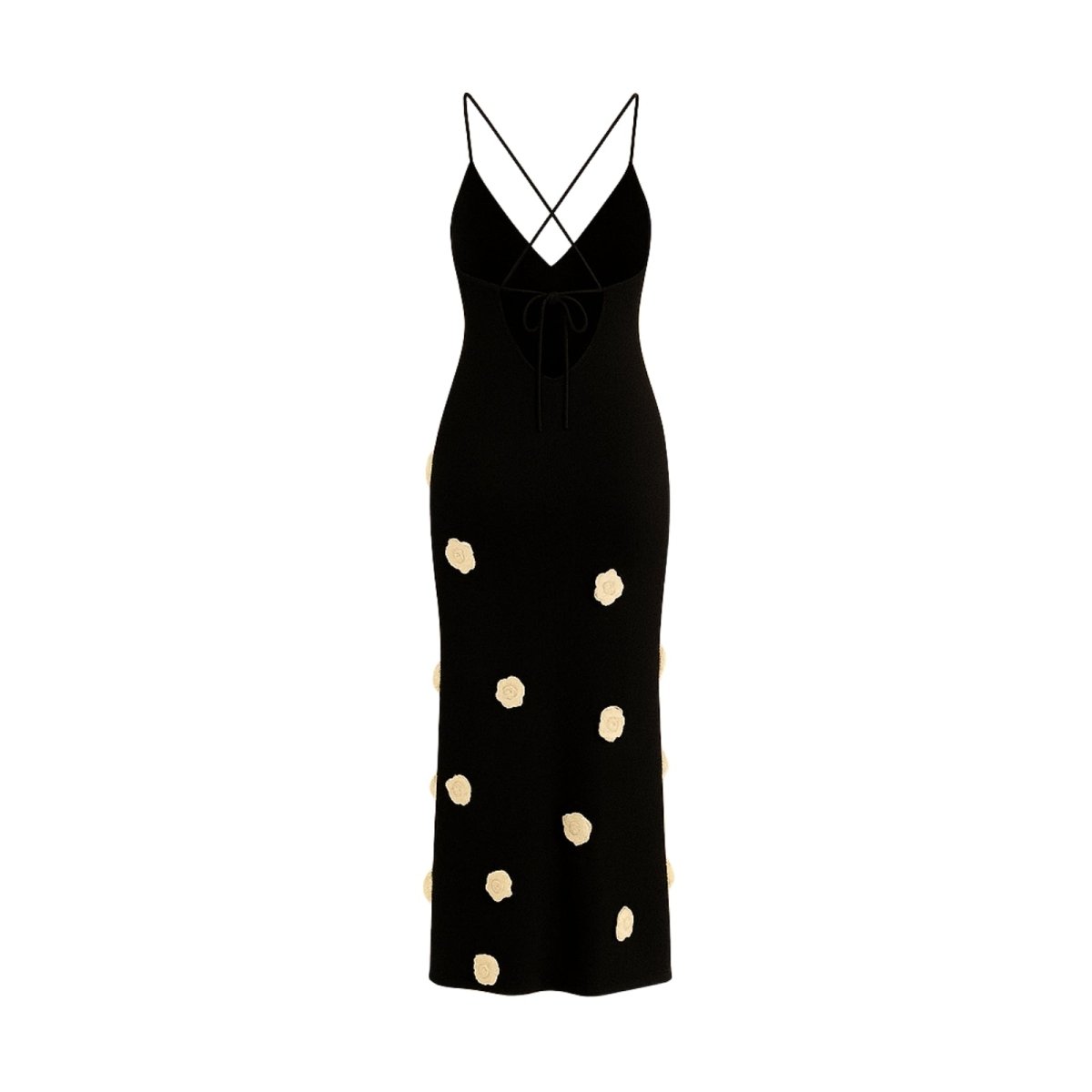 Black kouvr dress with gold polka dots on a white background
