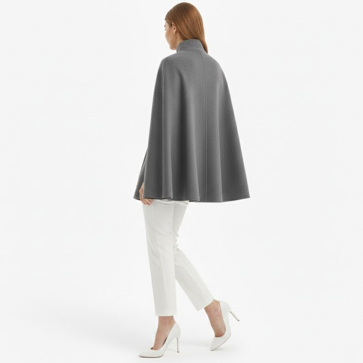 Back view of the grey wool cape coat showing its clean A-line drape and center seam detail.