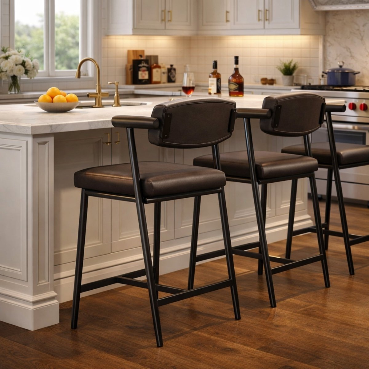 Rear view of two Kouvr upholstered counter stools showing the detail of the padded backrest and comfortable armrests at a kitchen counter.