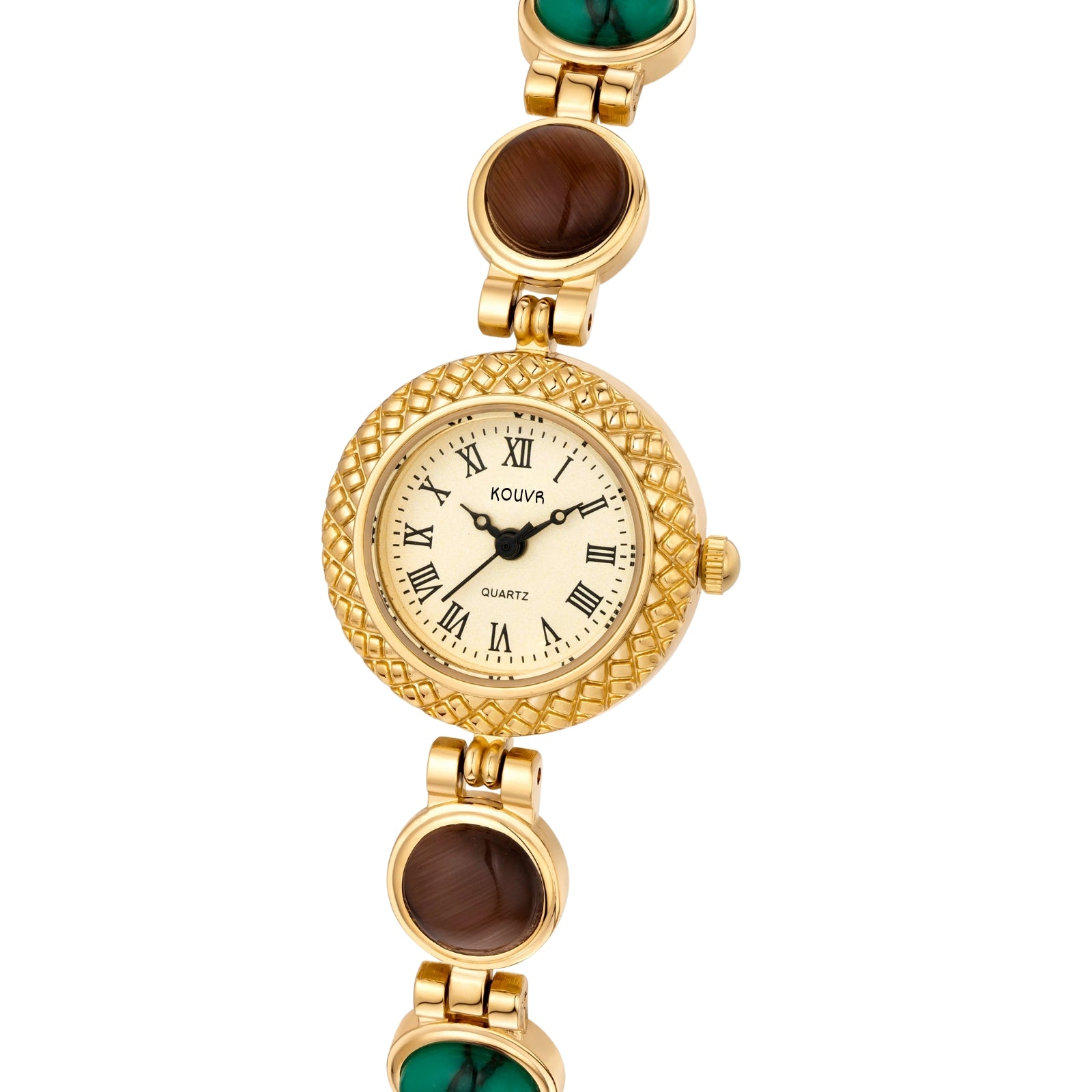 Gold kouvr wristwatch with gemstones on a wrist against a neutral background