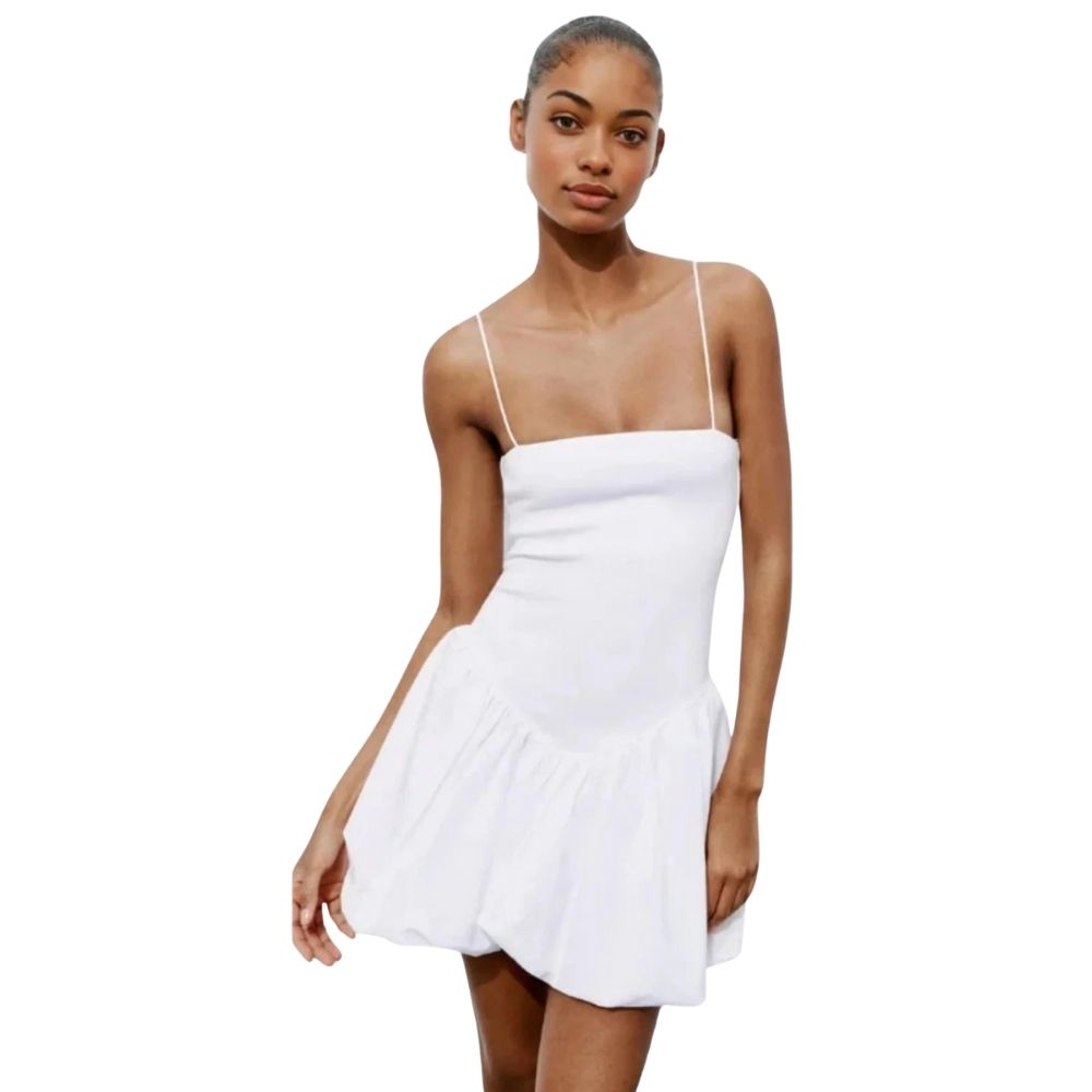 Model wearing the Kouvr white bubble hem mini dress with spaghetti straps