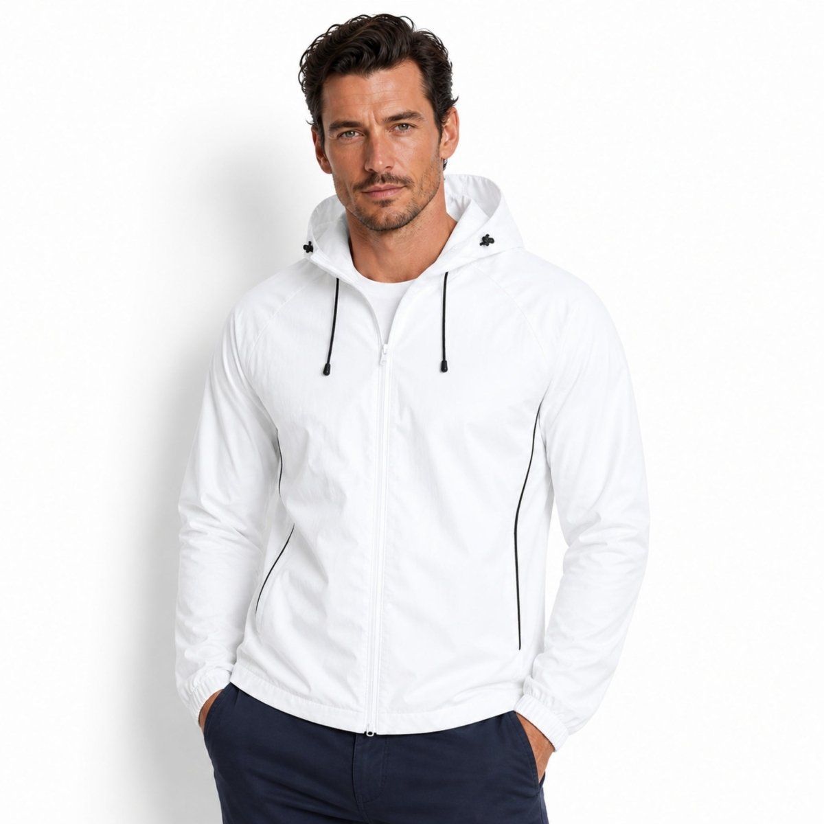 Man wearing Kouvr white zip up hooded athletic windbreaker jacket