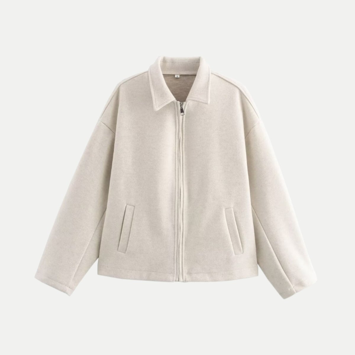 Studio flat lay front view of the Kouvr white wool blend zip jacket showing the silver zipper, shirt collar, and side welt pockets