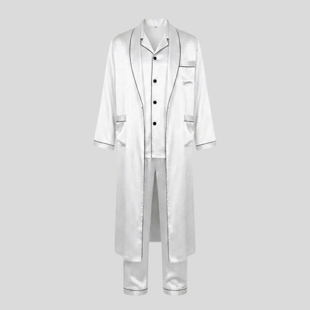 Flat lay of the Kouvr Wilson Set men's three-piece white silk pajama set including shirt, pants, and robe.
