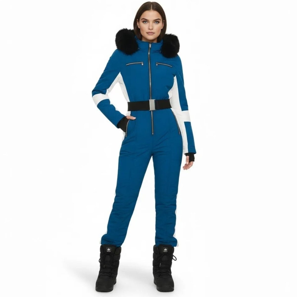 Woman wearing the Kouvr Fashion blue and white one-piece ski suit with a black fur hood and belt, front view.