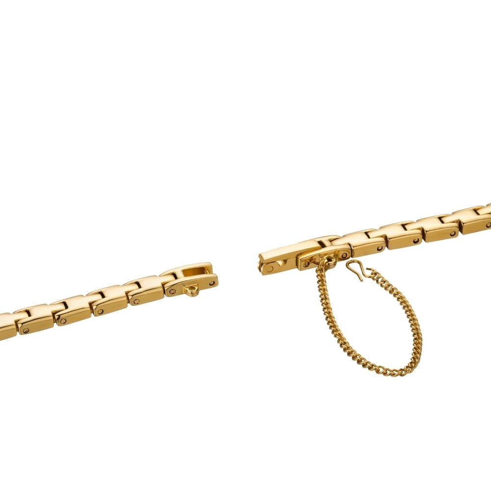 Gold Kouvr bracelet with a clasp on a white background