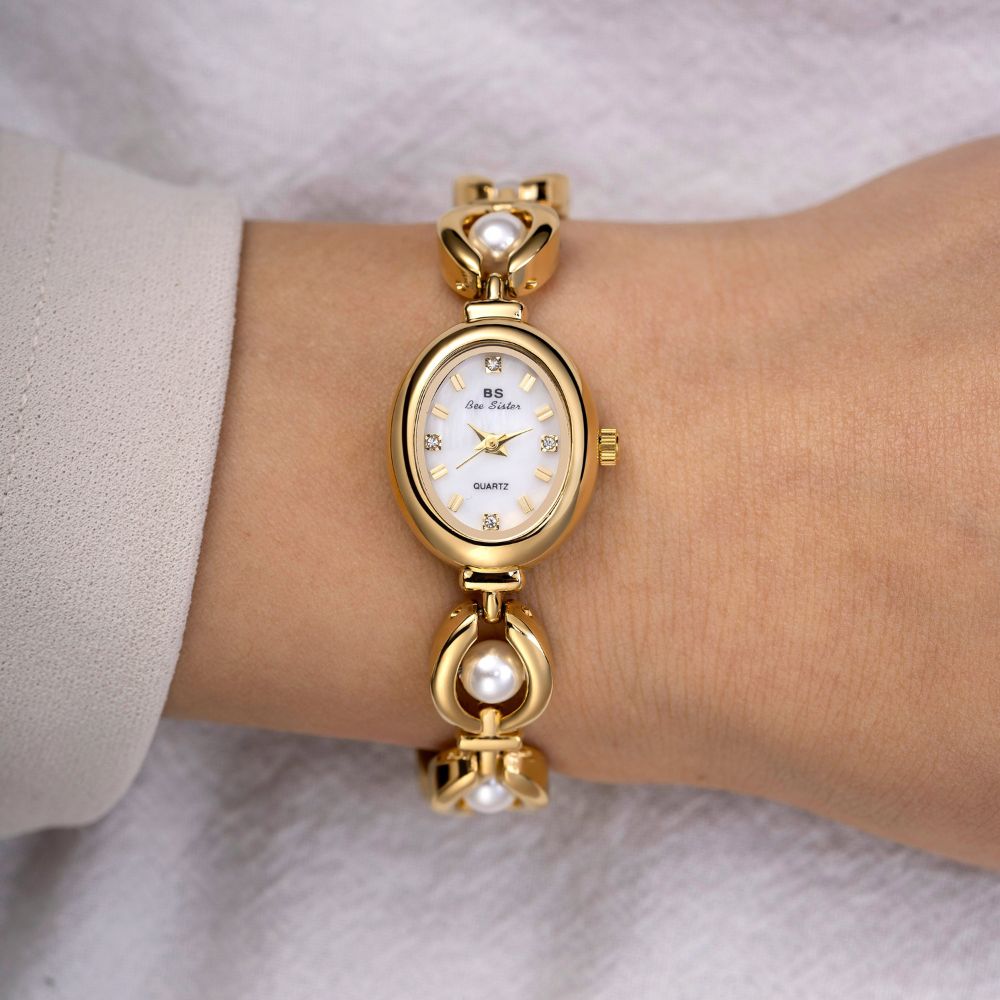 Kouvr Fashion Women's Gold Pearl Bracelet Watch on wrist