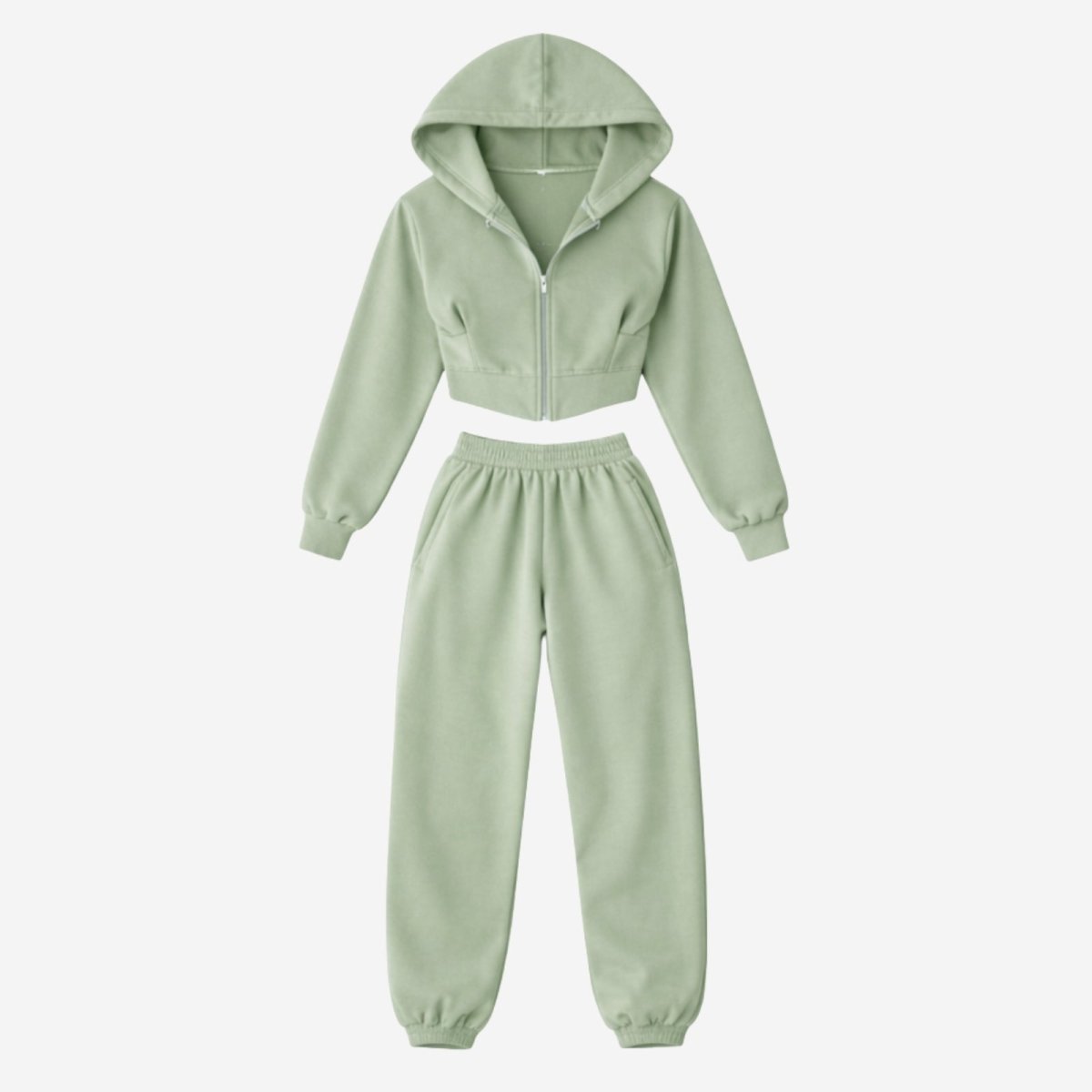 Flatlay of the Kouvr Fashion two-piece green loungewear set, showing the front of the cropped zip hoodie and joggers.