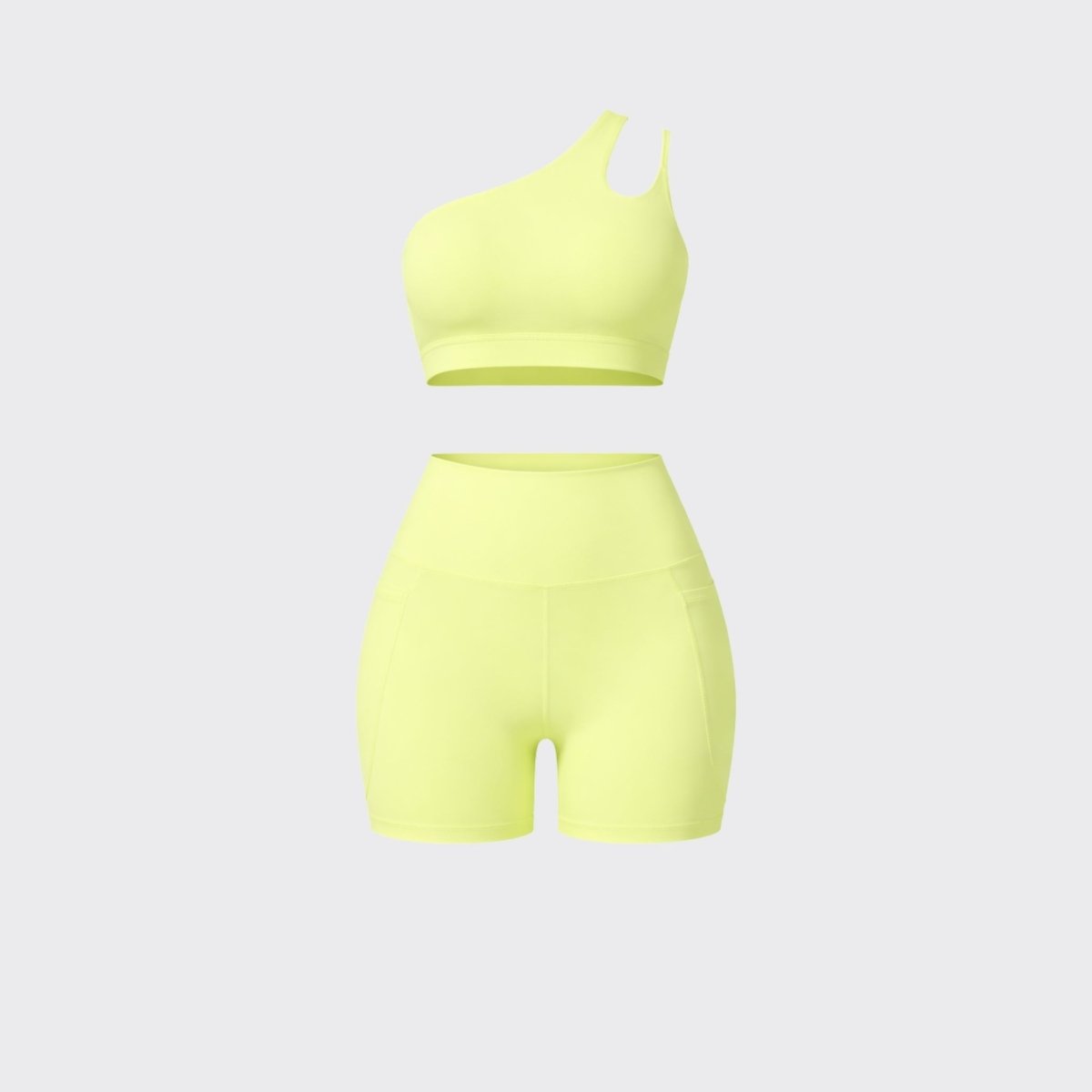 Front flatlay view of Kouvr yellow two piece activewear suit with asymmetric sports bra and high waist pocket shorts