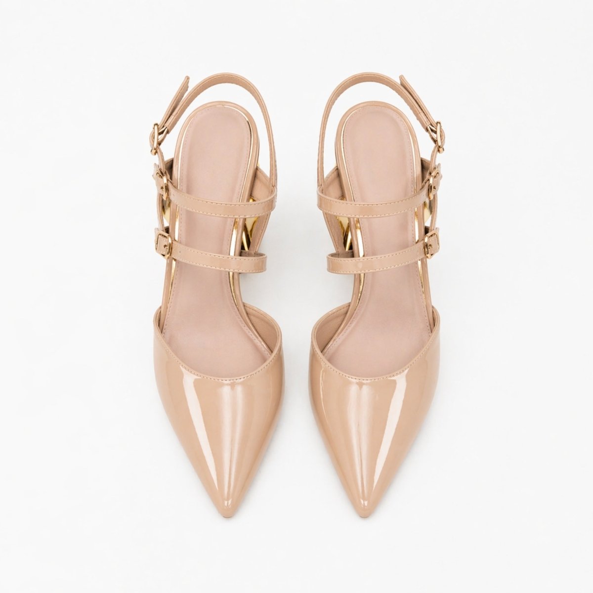 A pair of Kouvr Zuleika women's luxury pumps in glossy nude patent leather with a contrasting gold sculptural interlocking chain heel and matching ankle straps.