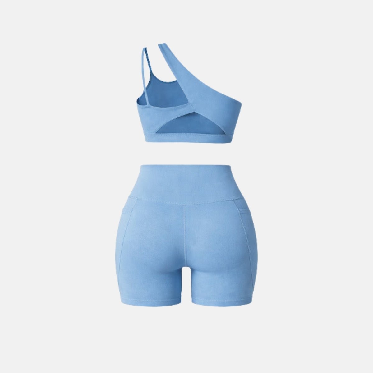 Back view of light blue matching workout set showing dual back strap design and high waisted short construction for women.